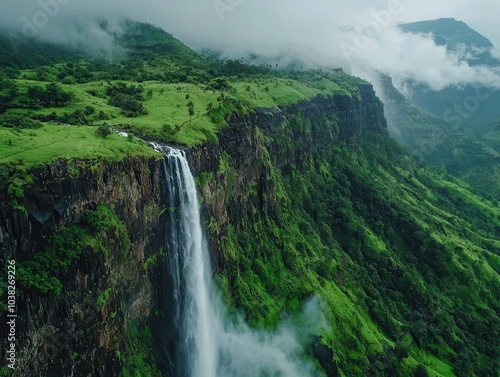 Aerial View of Lush Waterfall in Scenic Landscape