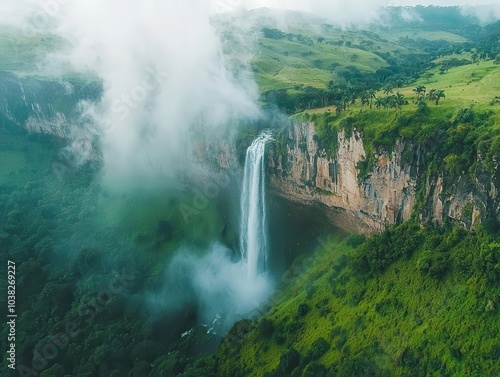 Aerial View of Waterfall Surrounded by Lush Landscape