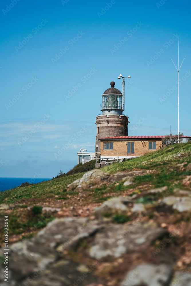 Kullen Lighthouse on a sunny day at Kullaberg Nature Reserve in Southern Sweden