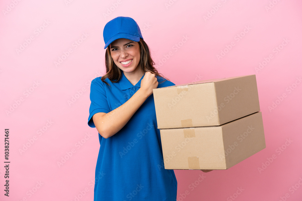 Delivery Italian woman isolated on pink background celebrating a victory Delivery Italian woman isolated on pink background celebrating a victory