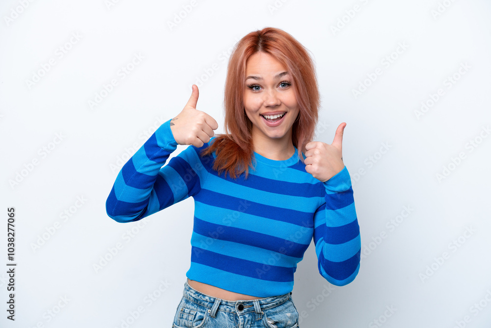 Young Russian girl isolated on white background giving a thumbs up gesture Young Russian girl isolated on white background giving a thumbs up gesture