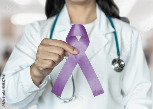 Orchid purple (lavender) ribbon awareness in doctors hand for (all kinds cancers), Testicular Cancer awareness, Craniosynostosis, Epilepsy, Hodgkin's lymphoma, National Cancer Prevention Month photo