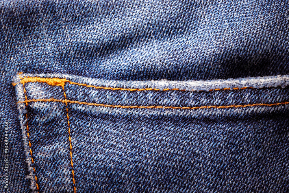 Worn denim trousers. Machine stitch close up. Denim texture in blue. The concept of repairing old clothes. Sewing factory. Worn denim trousers. Machine stitch close up. Denim texture in blue. The concept of repairing old clothes. Sewing factory.