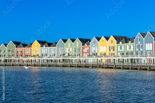 Skyline of Houten with famous Rainbow Houses in the Netherlands. Morning blue sky.