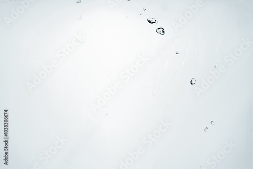 Water splash isolated on blue background. Transparent realistic water with movement and drops. Dynamic flight of water drops.