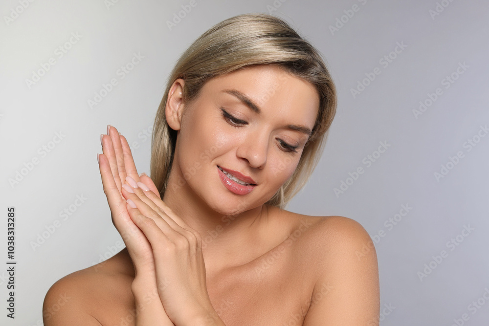 Cosmetology. Beautiful woman with perfect skin on grey background Cosmetology. Beautiful woman with perfect skin on grey background