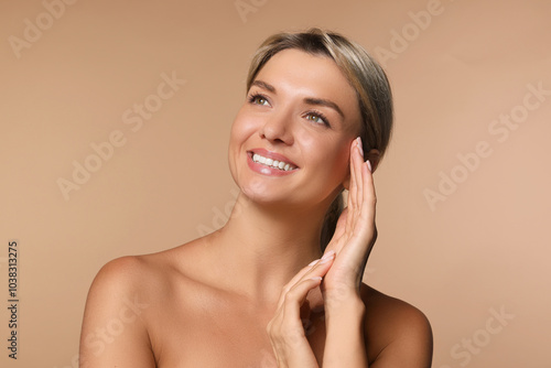 Cosmetology. Beautiful woman with perfect skin on beige background