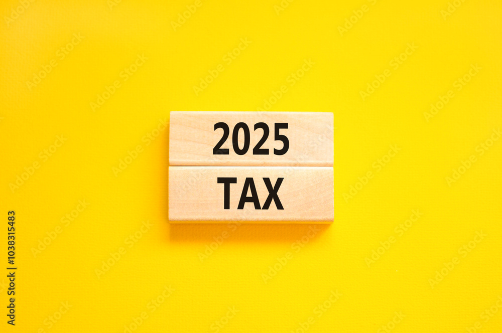 Planning 2025 tax new year symbol. Concept words 2025 Tax on beautiful wooden blocks. Beautiful yellow background. Business 2025 tax new year concept. Copy space. Planning 2025 tax new year symbol. Concept words 2025 Tax on beautiful wooden blocks. Beautiful yellow background. Business 2025 tax new year concept. Copy space.