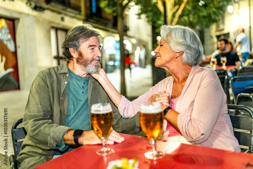 Senior woman caressing the face of her husband at bar Senior woman caressing the face of her husband at bar