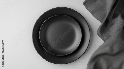 Black Plate with Cloth Napkin on Bright Surface