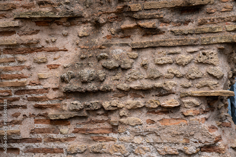 Ancient stone and brick wall with weathered textures, showcasing rustic and historical elements. Ideal for backgrounds, archaeology themes, or historical architecture projects. Ancient stone and brick wall with weathered textures, showcasing rustic and historical elements. Ideal for backgrounds, archaeology themes, or historical architecture projects.