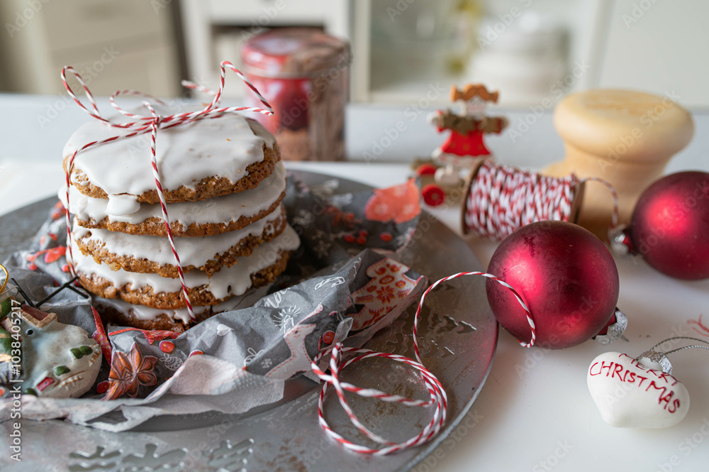 Fototapeta premium Homemade elisen gingerbread cookies traditional from germany with egg white glaze on kitchen counter