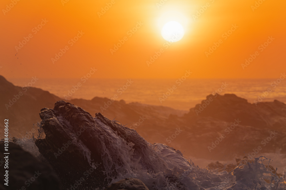 A breathtaking golden sunset over crashing ocean waves on a rocky shoreline. Perfect for nature, travel, and coastal landscape themes. Captures the serene beauty and tranquility of seaside evenings. A breathtaking golden sunset over crashing ocean waves on a rocky shoreline. Perfect for nature, travel, and coastal landscape themes. Captures the serene beauty and tranquility of seaside evenings.