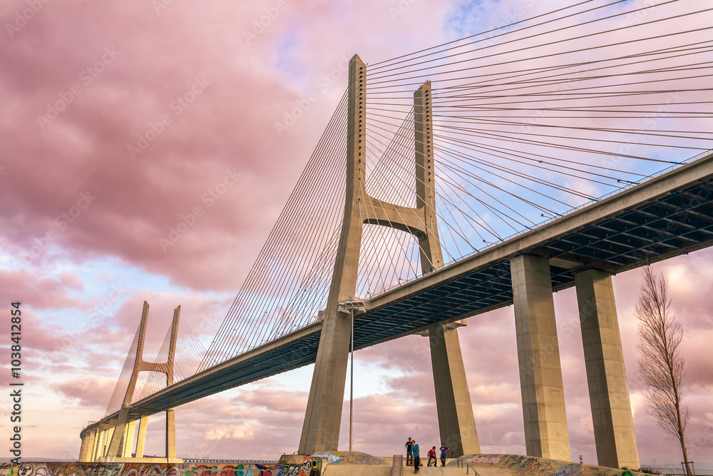 Fototapeta premium Lisbon, Portugal, March 1 2007, Vasco Da Gama Bridge Arches Over Lisbon's Tagus River