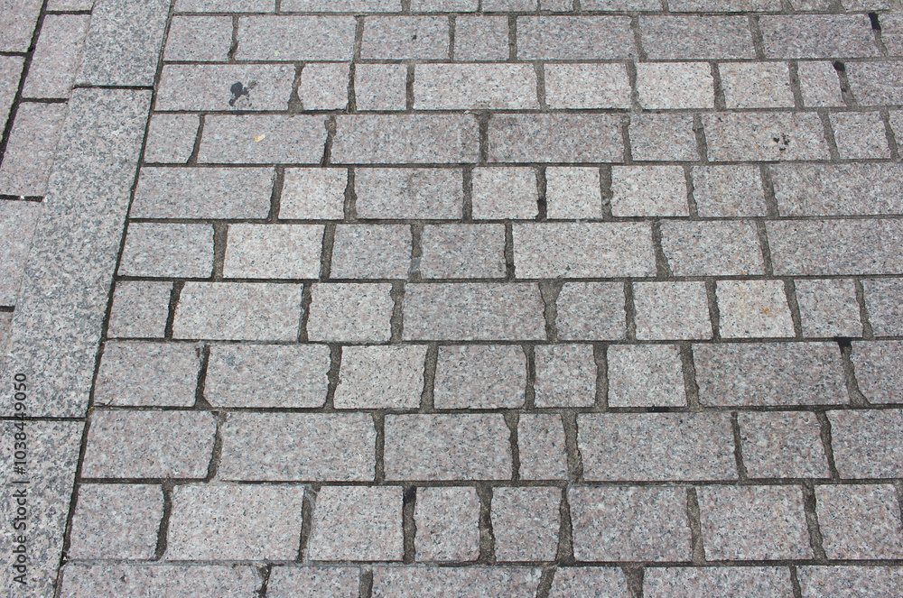 Texture of cobblestone. Pattern of sidewalk tiles in the street. Gray Pavement background. Texture of cobblestone. Pattern of sidewalk tiles in the street. Gray Pavement background.