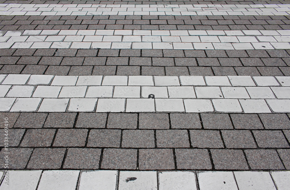 Texture of brown and white square paving tile. Pattern of sidewalk tiles in the street. Concrete pavers close up background. Texture of brown and white square paving tile. Pattern of sidewalk tiles in the street. Concrete pavers close up background.