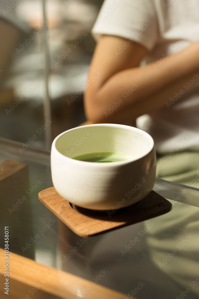A serene moment captured with a ceramic bowl of matcha, reflecting tranquility. A serene moment captured with a ceramic bowl of matcha, reflecting tranquility.