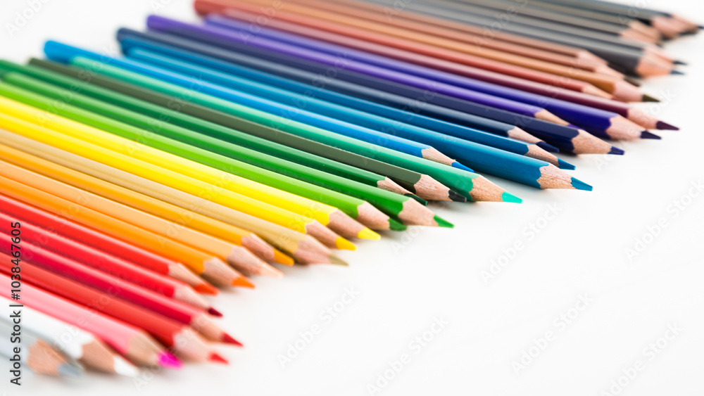 Colored pencils lying in irregular row Colored pencils lying in irregular row