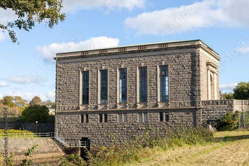 Old stone generator hall building at power plant in Laholm, Sweden. No visible people