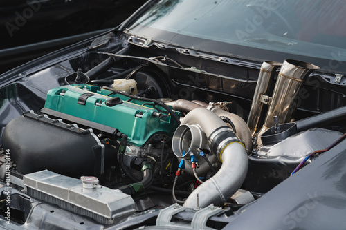 Bild auf Leinwand Close-up view of modified car engine, vibrant green valve cover, turbocharger, a
