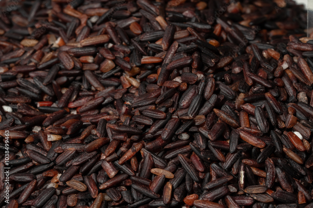 Raw Black Rice Grains Closeup | Super Food Wild Black Rice Background Raw Black Rice Grains Closeup | Super Food Wild Black Rice Background