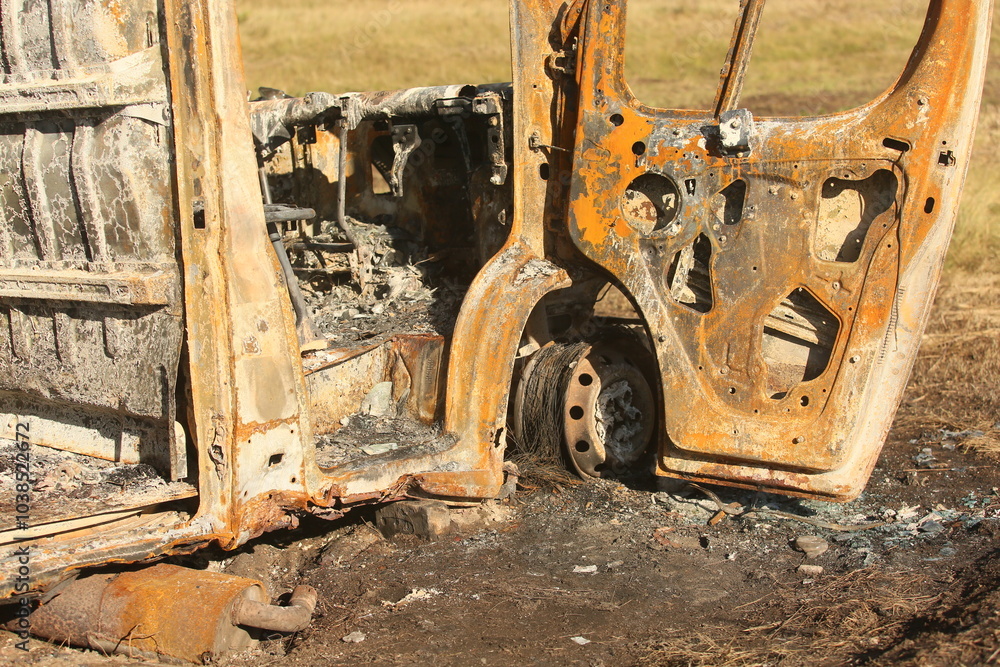 Fototapeta premium Big old burnt bus near the road