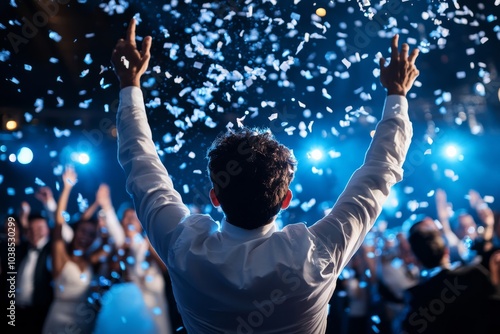 A lively crowd celebrating under a shower of blue confetti, with raised hands and a sense of jubilation in a colorful, vibrant, and energetic atmosphere.