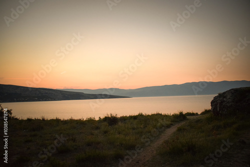 sunrise over the sea, clear sky without clouds. golden hour. 