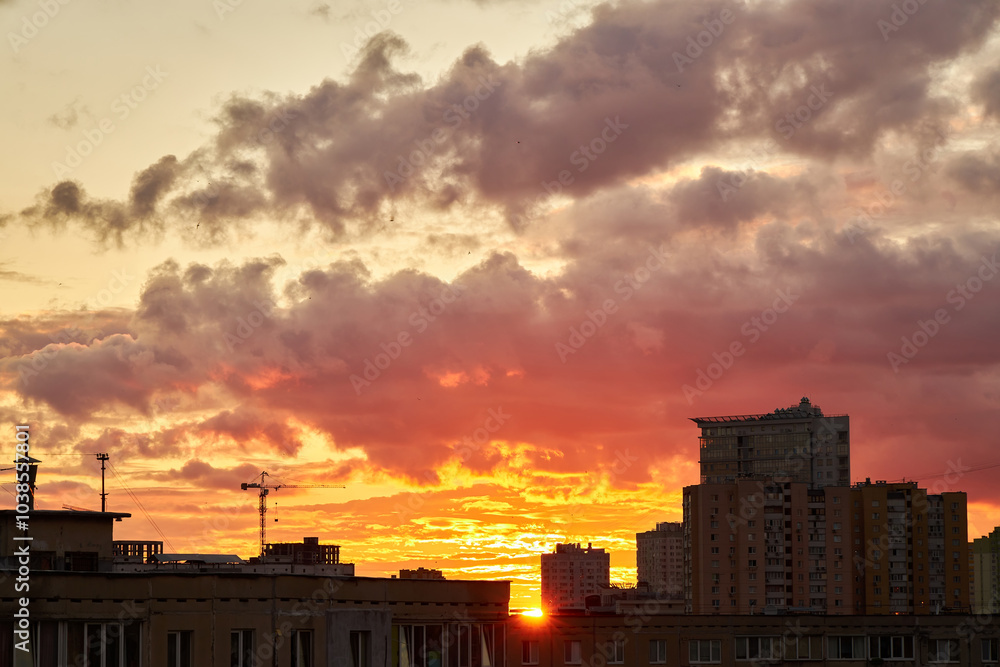 Dramatic Sunset Over City with Dark Clouds Dramatic Sunset Over City with Dark Clouds