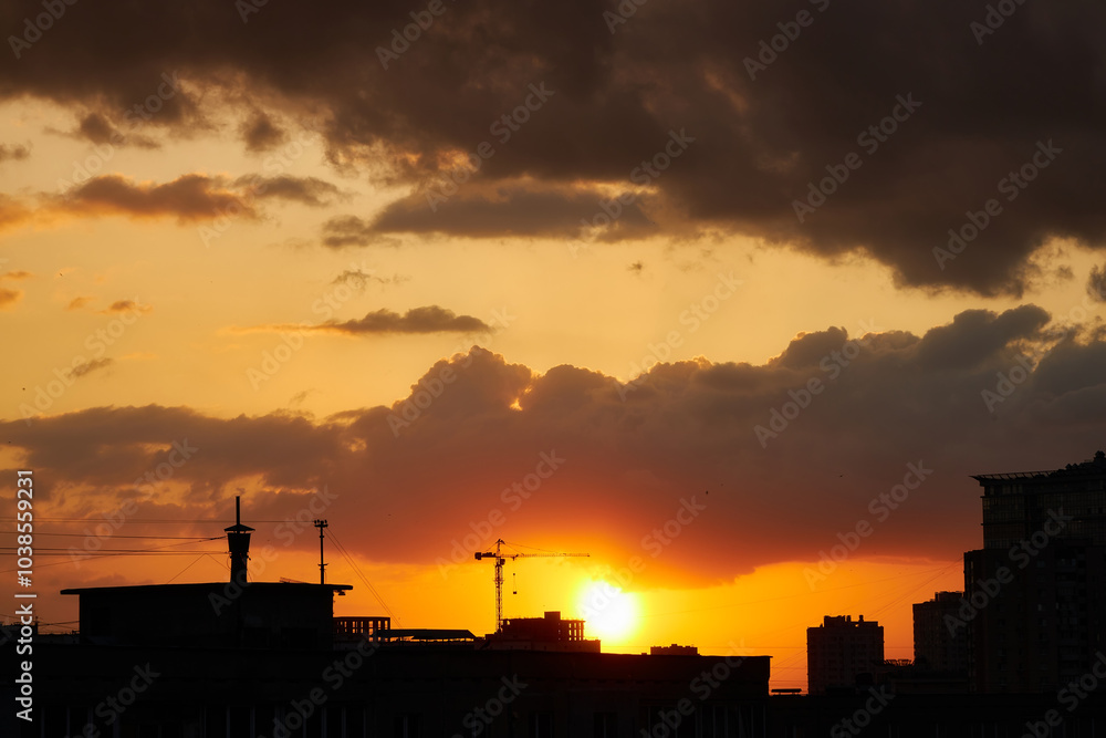 Silhouettes of Buildings Against a Fiery Sunset Silhouettes of Buildings Against a Fiery Sunset