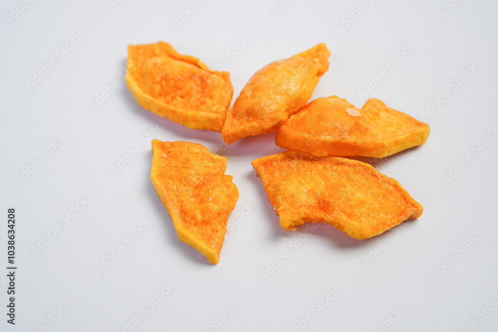 A pile of fried food with a yellowish color A pile of fried food with a yellowish color