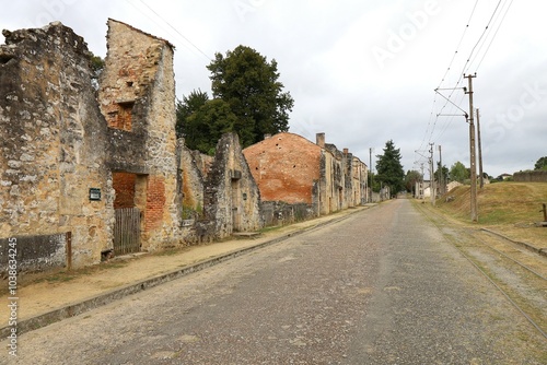 Rue de l'ancien village bordée des ruines des maisons incendiée par les nazis, village d'Oradour sur Glane, département de la Haute Vienne, France photo