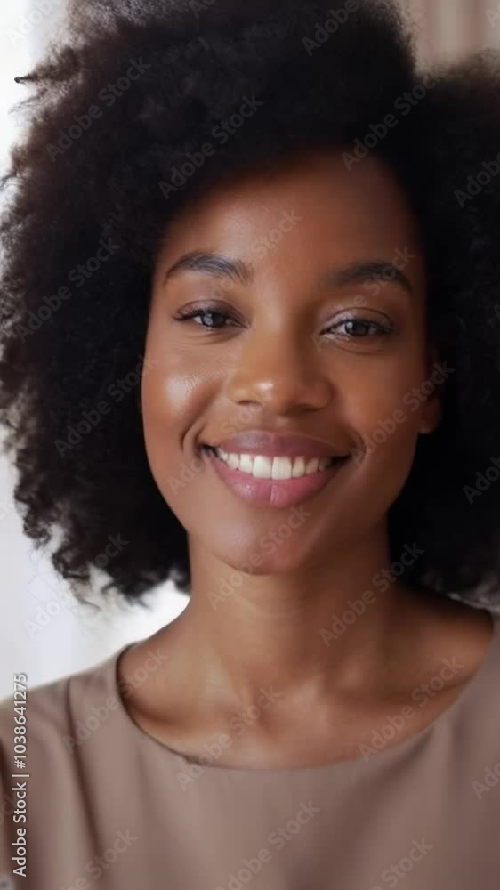 Portrait of a smiling woman with natural curly hair Portrait of a smiling woman with natural curly hair