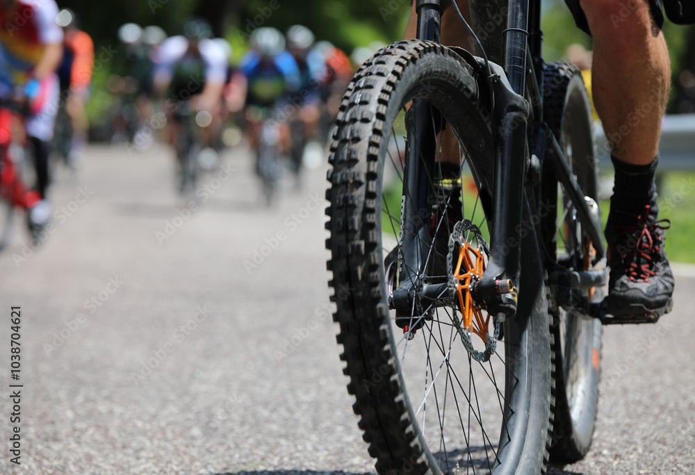 gravel bike tire flat during an uphill cycling race with other bikes gravel bike tire flat during an uphill cycling race with other bikes