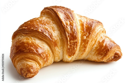 Freshly baked croissant resting on a white background