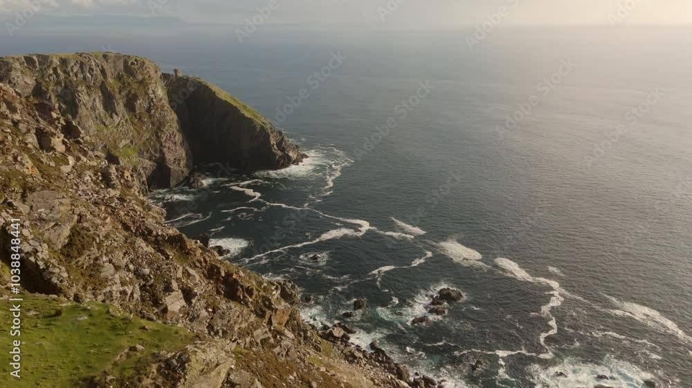 A breathtaking rocky coastline view under cloudy skies captures the tranquility of nature beautifully A breathtaking rocky coastline view under cloudy skies captures the tranquility of nature beautifully