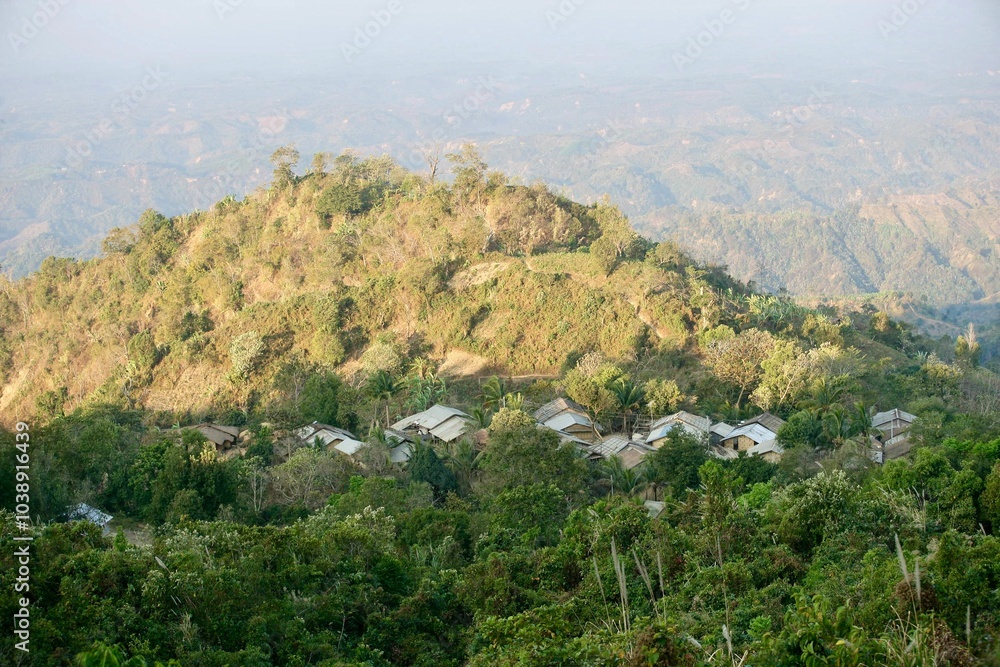 Obraz premium Houses of Bangladeshi indigenous people are in between hills