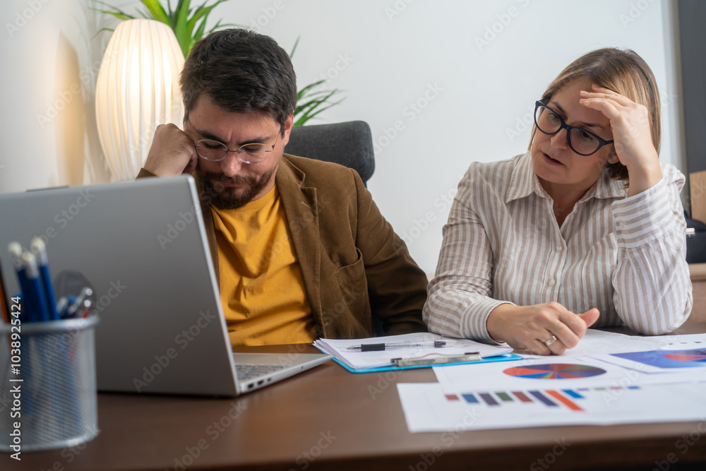 Conflicted office scene showing an angry female boss yelling at a frustrated male employee working on laptop. Tension highlights workplace stress and pressure during a business meeting. Conflicted office scene showing an angry female boss yelling at a frustrated male employee working on laptop. Tension highlights workplace stress and pressure during a business meeting.