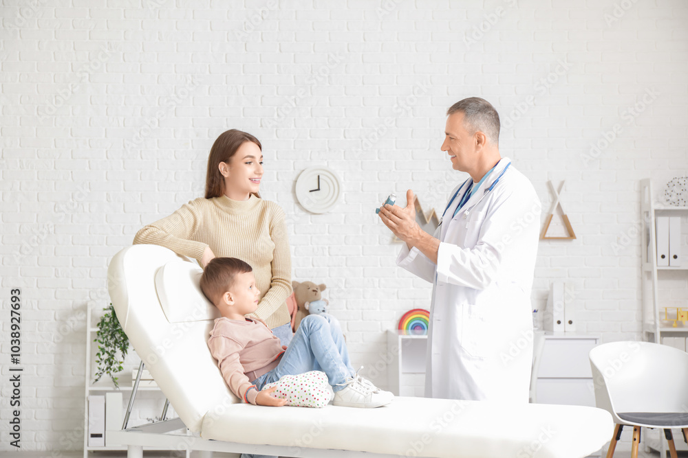 Fototapeta premium Little boy with mother at pediatrician's office