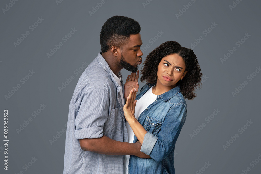 Flu Prevention. Annoyed African Woman Rejecting Kisses From Her Boyfriend, Afraid Of Germs And Coronavirus Spread Flu Prevention. Annoyed African Woman Rejecting Kisses From Her Boyfriend, Afraid Of Germs And Coronavirus Spread