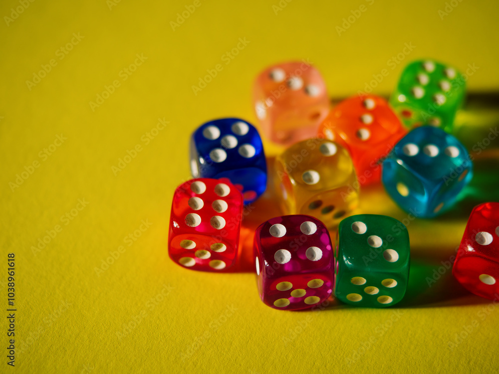 Color dices on yellow paper background. Cardboard bright background with texture. Concept of luck, testing fate, lottery, decision making. Place for text. Copy space. Rovinj, Croatia - October 4, 2024 Color dices on yellow paper background. Cardboard bright background with texture. Concept of luck, testing fate, lottery, decision making. Place for text. Copy space. Rovinj, Croatia - October 4, 2024