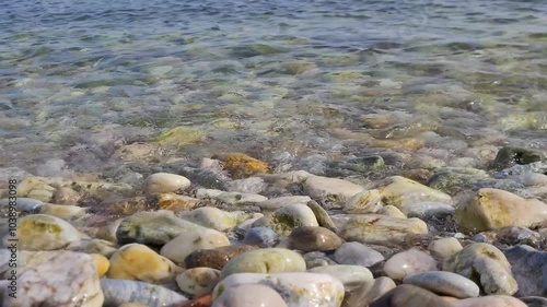 Waves and pebbles on a seashore	