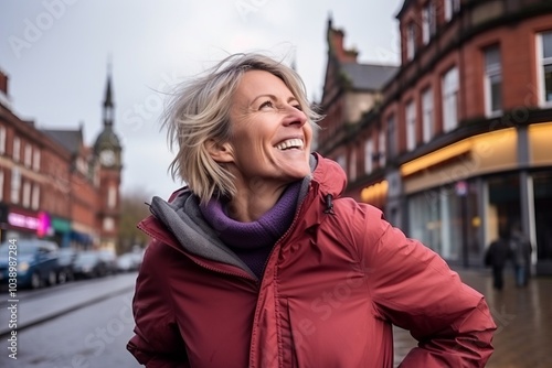 Happy senior woman in the city centre of Lincoln, Lincolnshire, UK photo