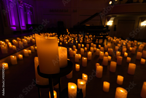 blurred symphonic orchestra on stage with lots of candles photo