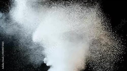 Highspeed footage capturing white powder particles explosively dispersing stark black background meticulously shot 30 frames second Phantom Flex camera 4K action blast bomb burst celebrate photo