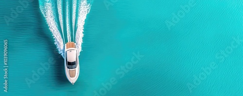 Aerial view of a white yacht cruising on crystal clear turquoise waters.