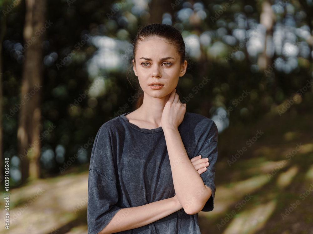 Thoughtful young woman standing outdoors in a serene natural setting, with a gentle expression and relaxed posture, contemplating life and nature Thoughtful young woman standing outdoors in a serene natural setting, with a gentle expression and relaxed posture, contemplating life and nature