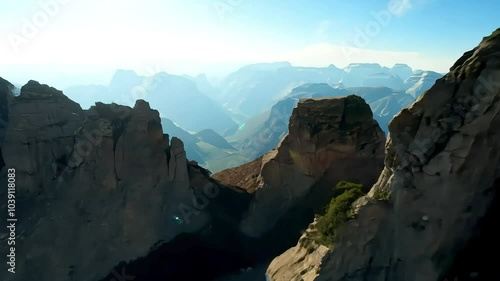 Sunset over mountain ridge with deep shadows in the valley photo