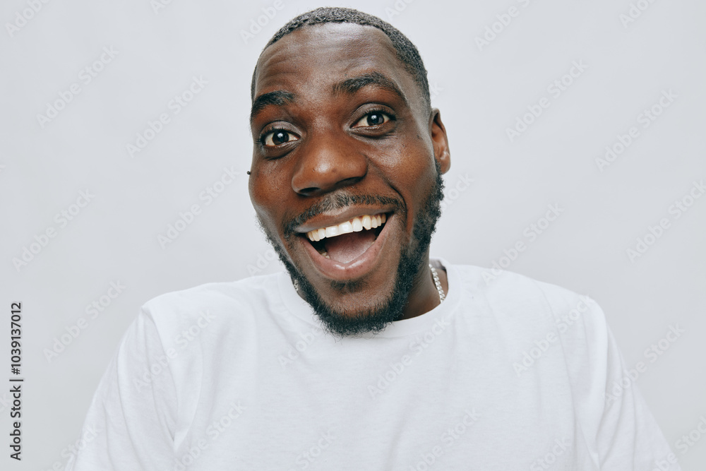 Smiling man portrait in a white shirt, exuding joy and positivity, set against a light neutral background, with a vibrant expression full of happiness and enthusiasm Smiling man portrait in a white shirt, exuding joy and positivity, set against a light neutral background, with a vibrant expression full of happiness and enthusiasm
