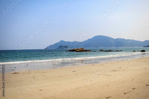 Serene Beach with Mountainous Backdrop and Clear Blue Sky, Sai Kung, Hong Kong